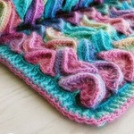 Помогите найти описание или видео вязания пледа.